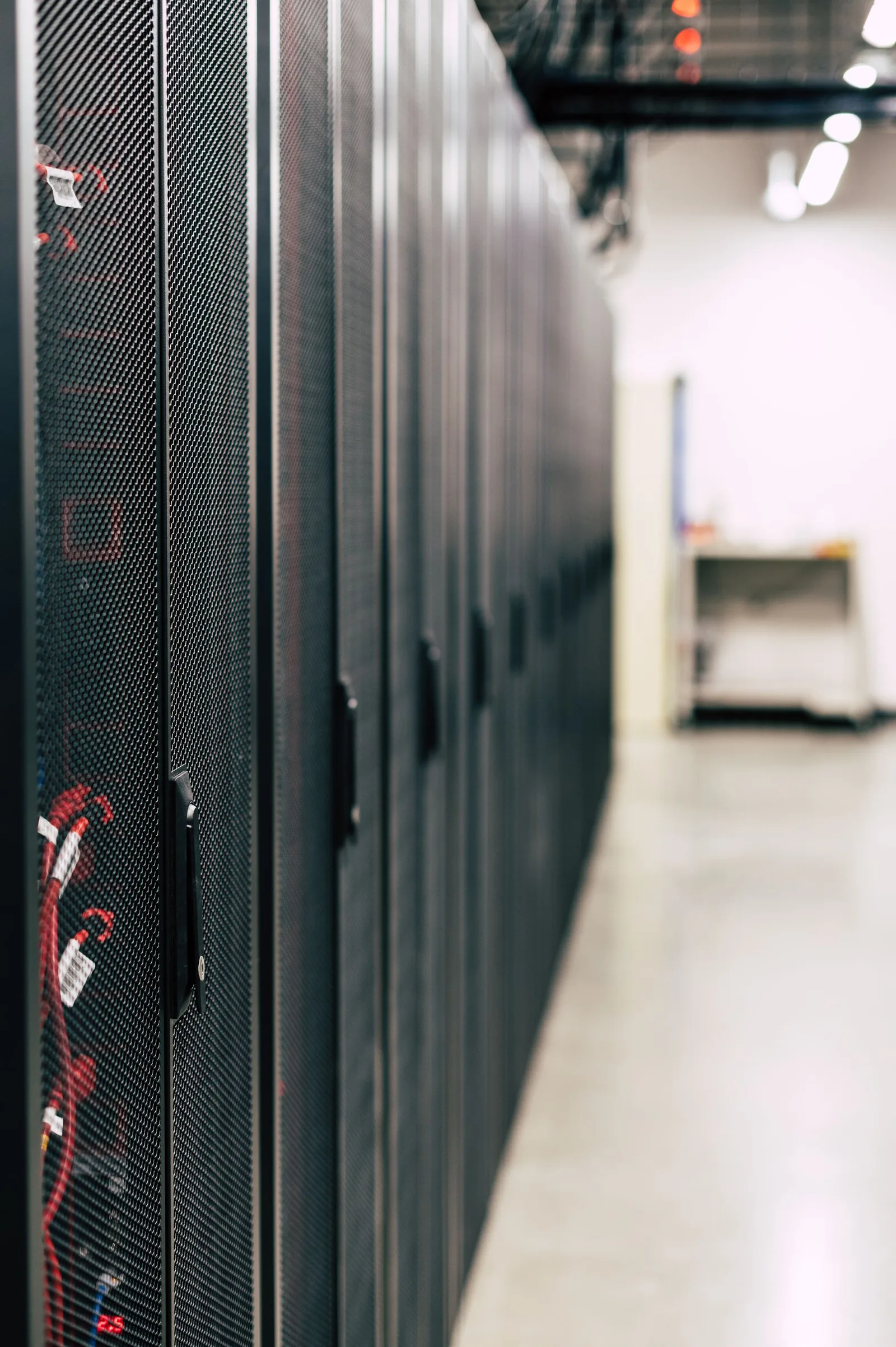 Server racks in a data centre; illustrative stock, not an ITQAN facility.
